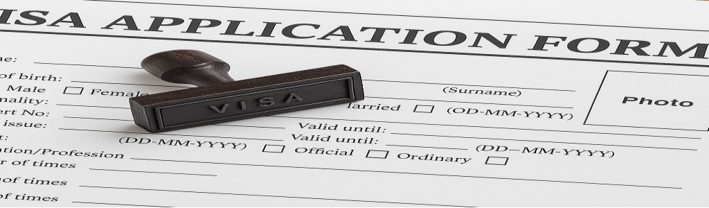 A visa application form featuring an official stamp marked "VISA"